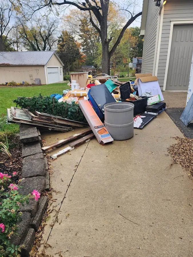 Dumpster being loaded with debris for 30 Yard Dumpster Rental in Ballston Spa